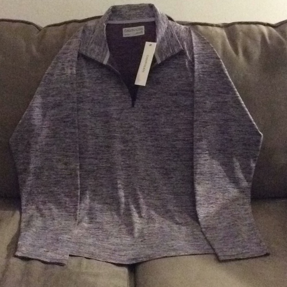 a men’s Calvin Klein pullover shirt 👔 zip up 💕💕